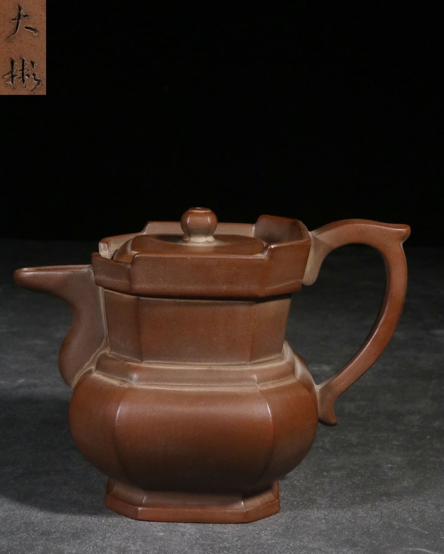 A Zisha Teapot: A Zisha Teapot. Height: 4.76in; Length: 6.89in; Diameter: 4.13in; Weight: 1.13lbs.