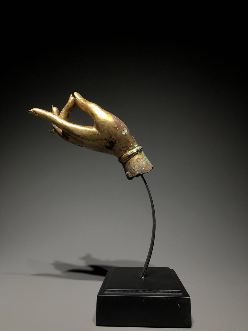 A Gilt Bronze Buddha Hand: A Gilt Bronze Buddha Hand. Dimensions: 7.87in x 3.15in x 2.36in; Weight: 4.19lbs.