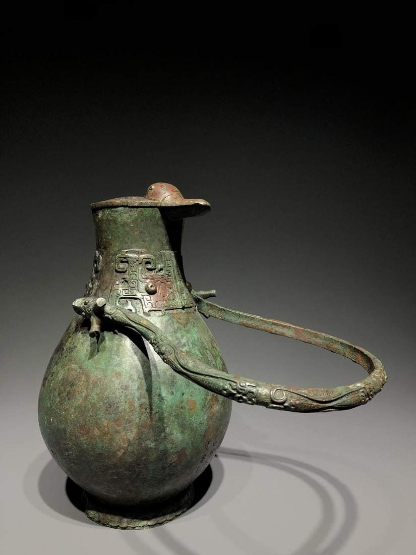 A Bronze Duck-Spout Vessel: A Bronze Duck-Spout Vessel. Diameter: 7.87in; Thickness: 6.69in; Height: 16.54in; Weight: 17.64lbs.