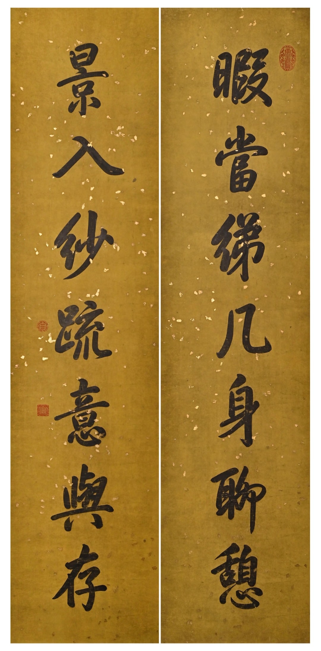 A SEVEN-CHARACTER COUPLET WRITTEN IN RUNNING SCRIPT BY EMPEROR QIANLONG OF THE QING DYNASTY: A SEVEN-CHARACTER COUPLET WRITTEN IN RUNNING SCRIPT BY EMPEROR QIANLONG OF THE QING DYNASTY (1711-1799). H:175cm(68.90in) W:41cm(16.14in)painted on golden speckled yellow paper. The calligraphy