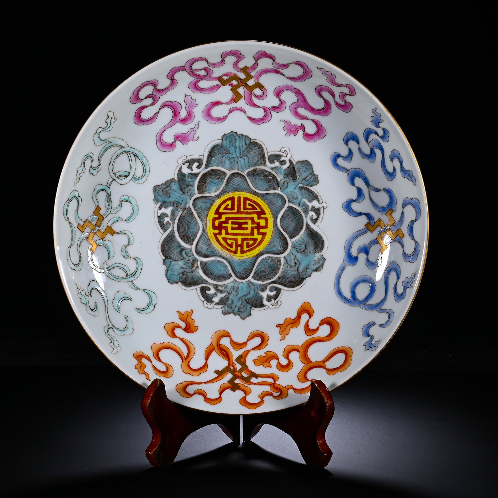 QING DAOGUANG PASTEL SEA STONE EIGHT TREASURES LONGEVITY PATTERN PLATE: QING DAOGUANG PASTEL SEA STONE EIGHT TREASURES LONGEVITY PATTERN PLATE. Diameter:27cm(10.63in)Shallow-bowl plate with flared rim, gilded edge and raised foot-ring. Centre painted with sea-rock and