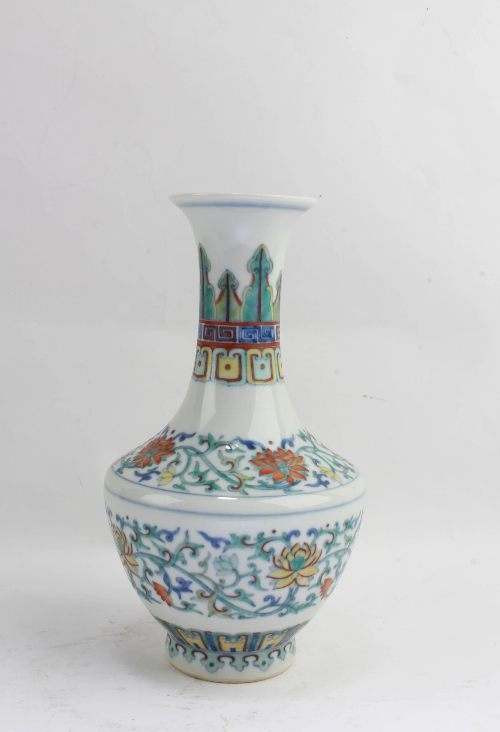 Chinese Famille Rose Porcelain Vase: Chinese Famille Rose Porcelain Vase. 'QianLong' mark at base. Height: 8.25"