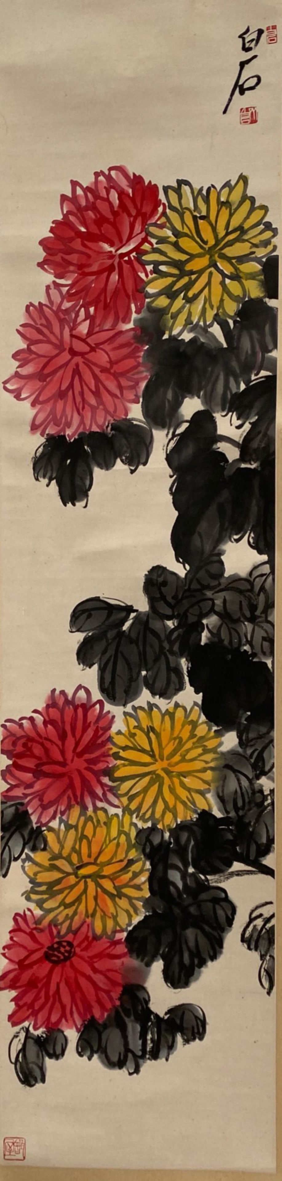 Chinese Hanging Scroll Painting: Ink and color on paper, depicting chrysanthemums, signed with seal attributed to Qi Bai Shi. Length: 13" Height: 53.5"