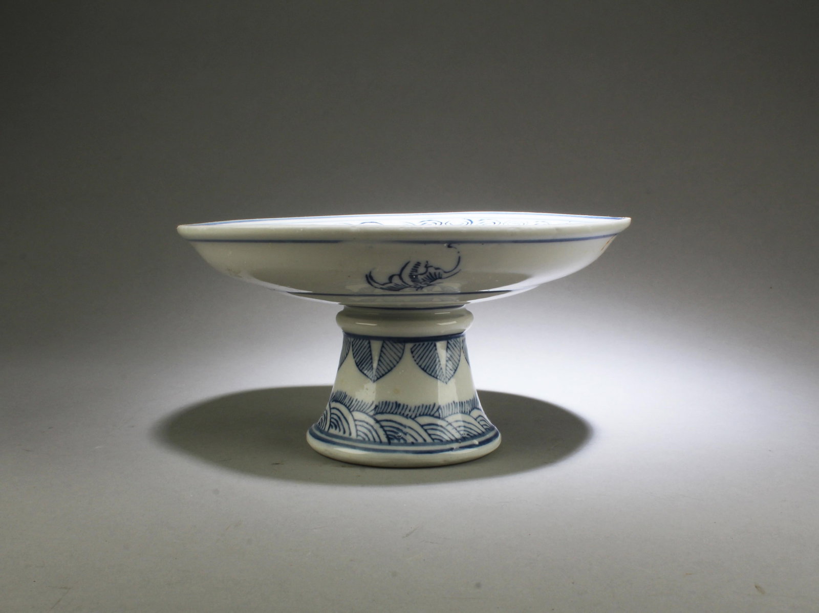 A Blue & White Stem Plate: A Blue & White Stem Plate. Height: 4" Diameter: 7.75"