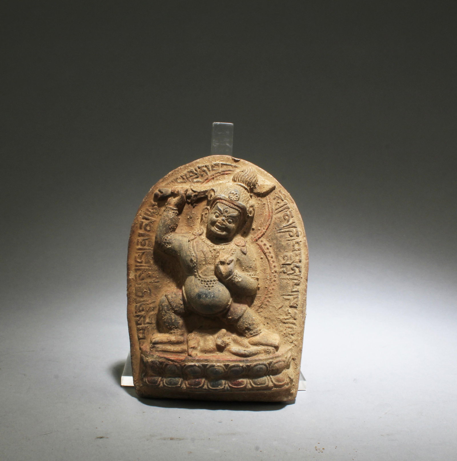 A Clay Buddha Statue: A Clay Buddha Statue. Height: 4.25" Length: 3.3" Width: 1"