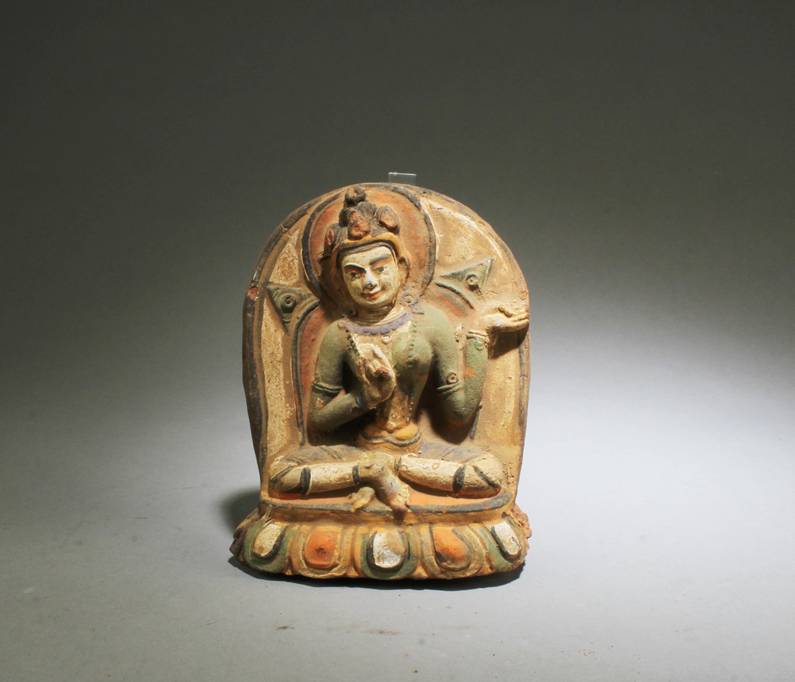 A Clay Buddha Statue: A Clay Buddha Statue. Height: 5" Length: 3.75" Width: 1"