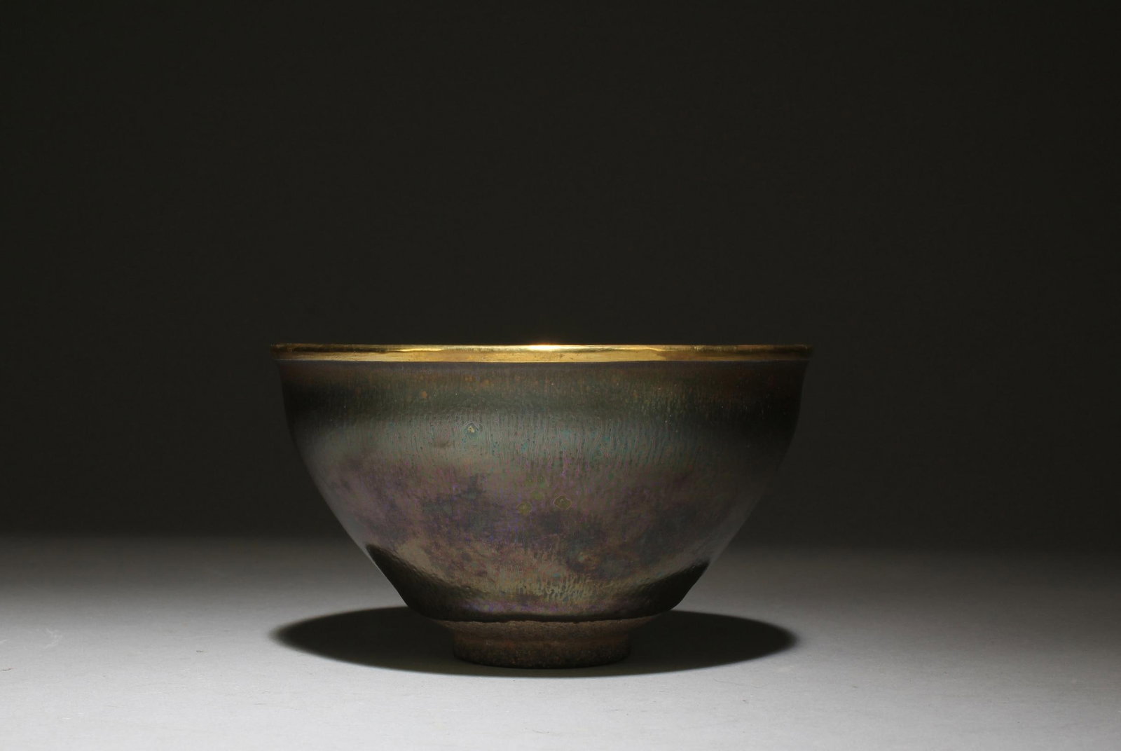 A JianYao Bowl: A JianYao Bowl, the mouth rim with gilt bronze lining. Height: 2.75 Diameter: 5"