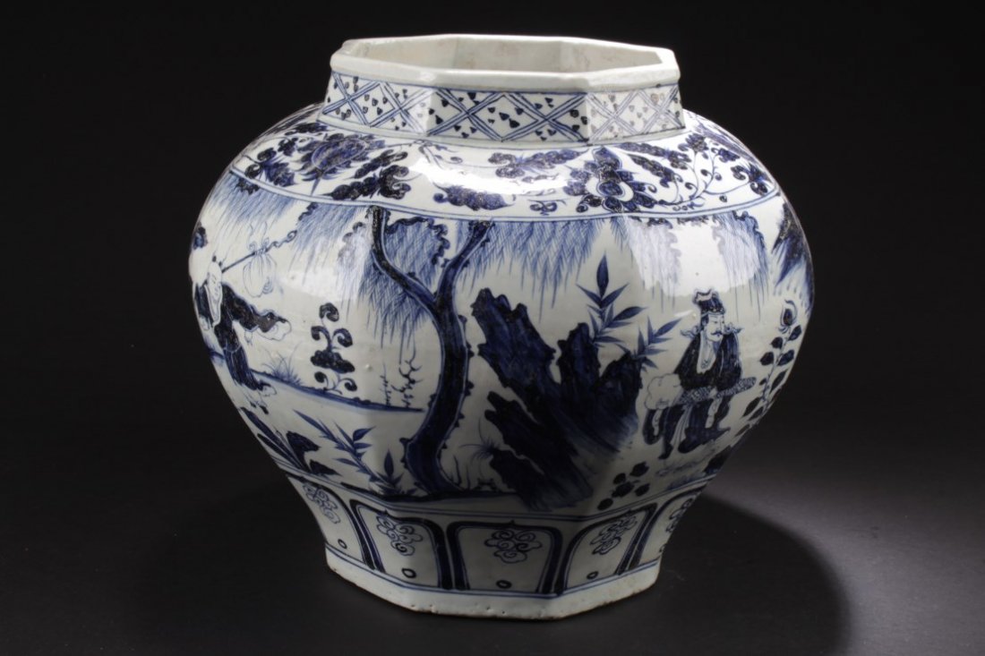 Chinese Blue & White Porcelain Jar: Of broad shoulders and rising to a short neck, the porcelain jar is painted with cobalt blue images of figures in landscape scenery. Height: 11.5 "
