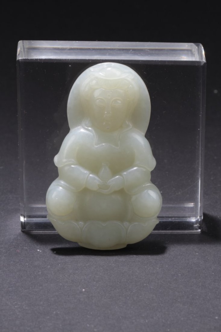 Chinese Jade Pendant: Chinese Jade carved Pendant, depicting a guanyin seated on a lotus throne. Height: 2 "