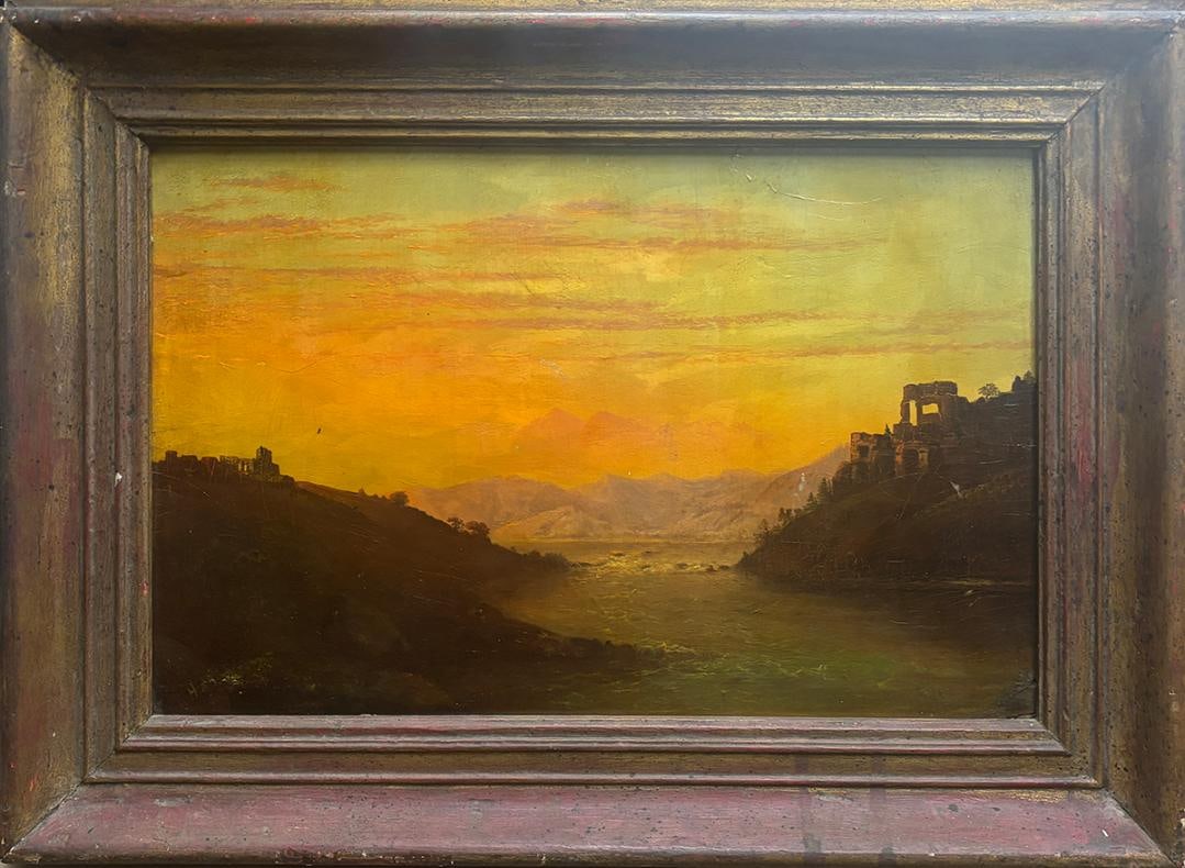Original 19'th Century oil painting on panel 1810-1850 The painting depicts a dramatic sunset over: Original 19'th Century oil painting on panel 1810-1850 The painting depicts a dramatic sunset over the river with castles over the hills on each side Masterfully done beautiful colors signed lower lef
