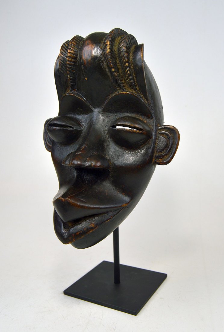 A Whimsical Dan Bassa African mask (1 of 3)