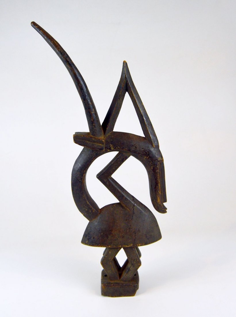 Old Abstract Chiwara Antelope Headdress from the Bamana: A very old and abstract Chiwara headdress sculpture from the Bamana ( Bambara ) peoples of Mali, West Africa. This figure measures 21.5 inches tall.Among the Bamana, oral traditions credit a mythical 