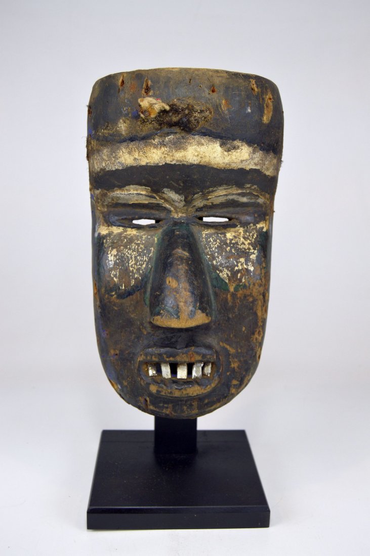 Very Old Bete African African Mask Ex Museum Provenance: Very old carved wooden mask from the Bete ethnic group, within the Dan complex of tribes, Cote De Ivorie, West Africa. A well handled, field used example with inset metal teeth and signs of multiple l
