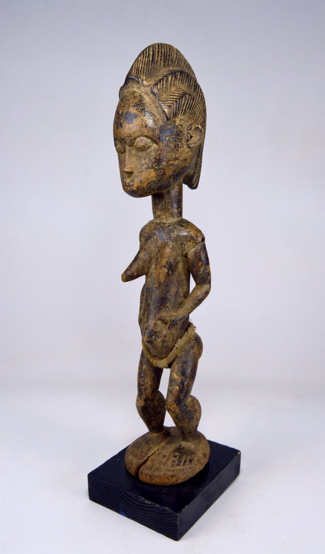 Vintage Baule Spirit Wife sculpture African Art: Old Baule wood sculpture of a female Spirit Wife , Or "Blolo Bla" from Cote De Ivorie, West Africa. This Vintage to antique idol has a very well worn and well handled surface patina.The sculpture meas