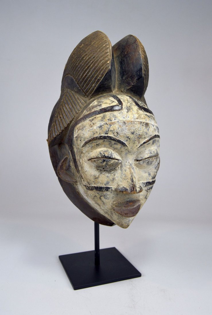 A Punu Mukudj African mask with painted facial designs (1 of 7)