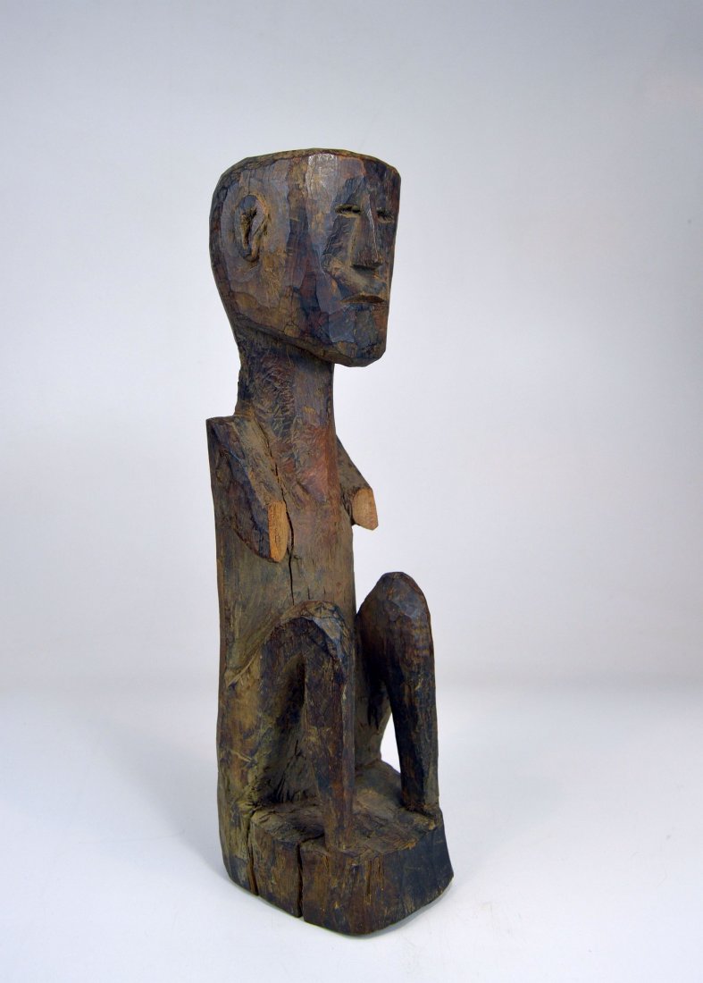 Old Dopal Guardian sculpture from Nepal, Himalayan: This is a very old wooden ancestor shrine sculpture from Western Nepal. Such sculptures were placed on bridges, at crossroads and placed on shrines and fresh water springs as protection from evil spir