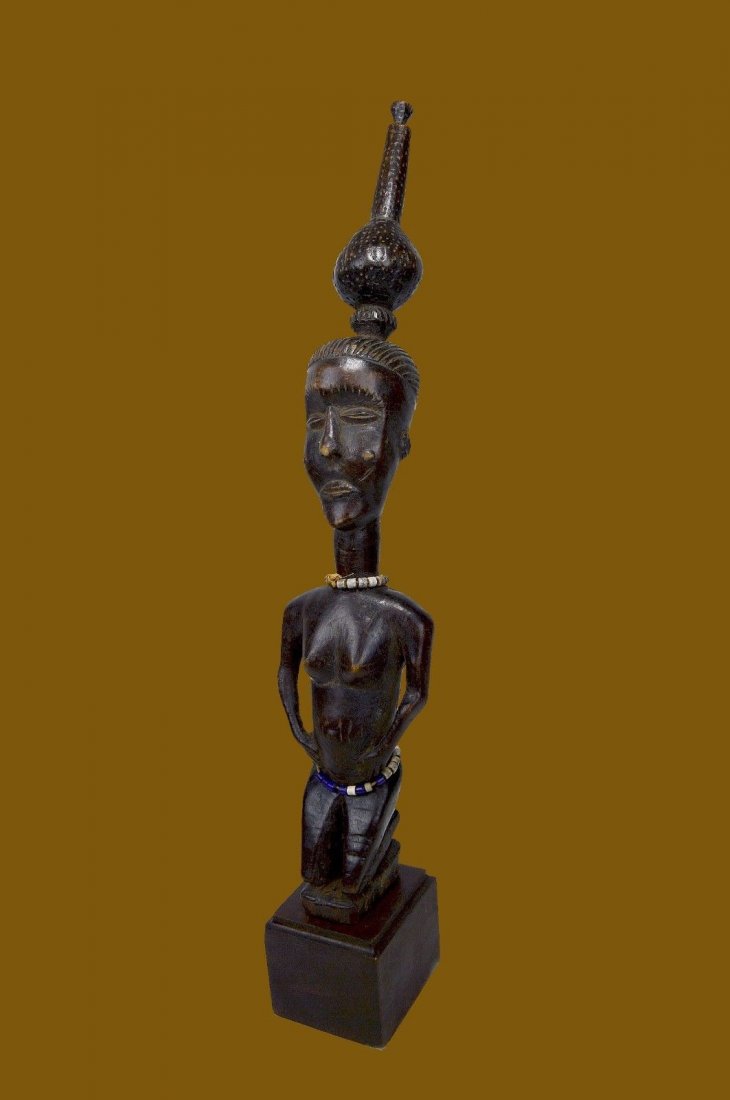 Old LUBA Female Divination idol w/ Palm wine container: A Very rare, old and interesting wooden idol from the LUBA peoples of The Congo (DRC) Central; Africa. This is a most fascinating example of a personal divination idol. Featuring a tall elongated fema