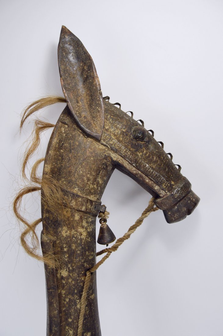 A Charming Bamana Hobby Horse, African Art: A very finely crafted wooden hobby horse with metal wrapped face featuring ornate designs as well as a bronze bell. The Entire piece is very well made and solid. Bamana peoples, mali, Africa. The Hobb