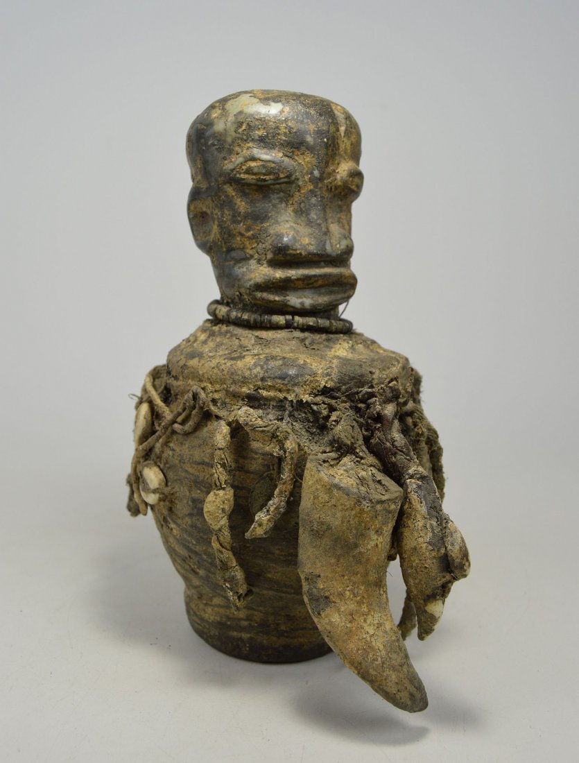 a Rare Old Kissi Magic Fetish Vessel with Ancestor face (1 of 6)