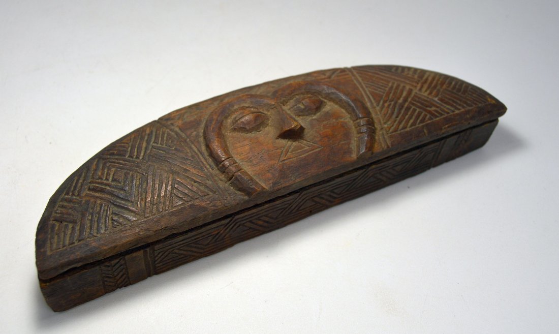 Old Kuba Kutula Powder Make Up container, African Art: This is a finely carved vintage wooden container from the Kuba peoples, Congo, Africa. Elaborate and well carved wooden container in crescent moon shape with mask like face on lid along with incised g