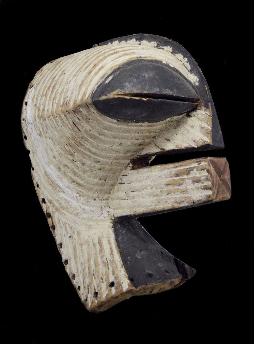 OLD SONGYE KIFWEBE AFRICAN MASK: An old carved wooden mask in classic form with incised linear designs and cubist like features. Songye peoples, DRC / Congo, Africa.Certain masking traditions of the Congo River basin personify local 