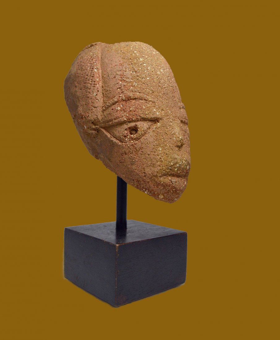 A RARE ANCIENT NOK TERRACOTTA HEAD: This is a classic Nok terracotta head from Nigeria, West Africa.Estimated to be from around 500 BC till about 200 AD. Nok culture, named after the village on the Jos plateu in Nigeria where it was fir