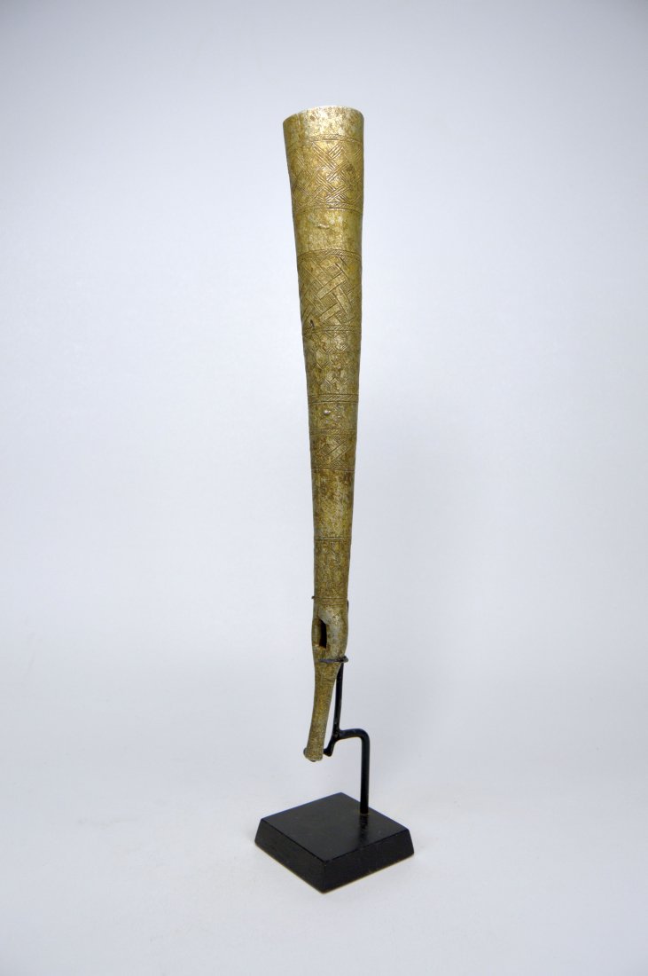 KUBA ALUMINUM OILPHANT / SIDE BLOWN TRUMPET WITH DESIGN: This is an unusual find, a incised and decorated side blown trumpet or "Oilphant" from the Kuba peoples of the Congo, central Africa. The entire trumpet is decorated with intricate geometric designs s