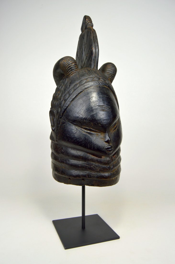 A MENDE BUNDU SOCIETY FEMALE INITIATION MASK (1 of 8)