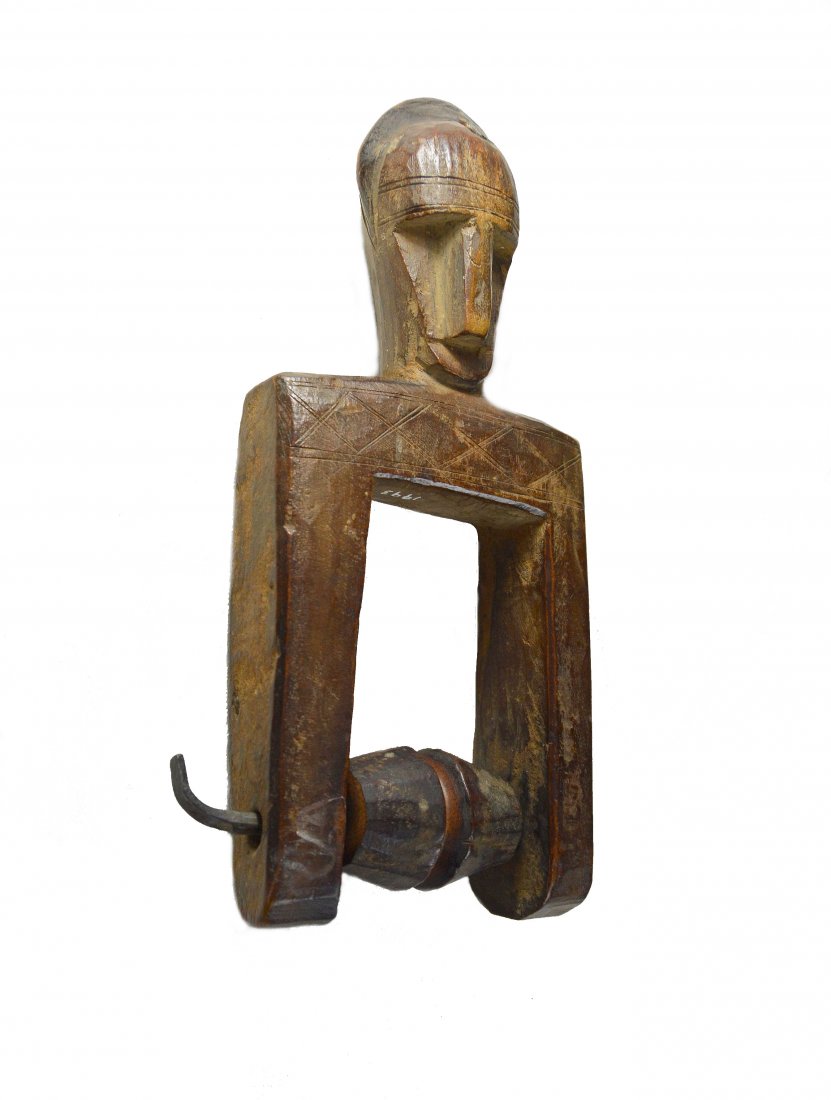 Old Bamana Heddle Pulley for Weaving Ex Bob Banks Coll.: A Very Old and well used Heddle weaving pulley from the Bamana peoples, Mali, Africa. Carved wood with mask like central face and a golden honey colored well handled surface patina. The Pulley has col