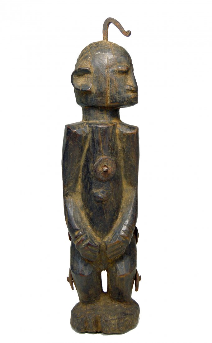 A Dogon Shrine idol with Iron disc shaped adornment (1 of 6)