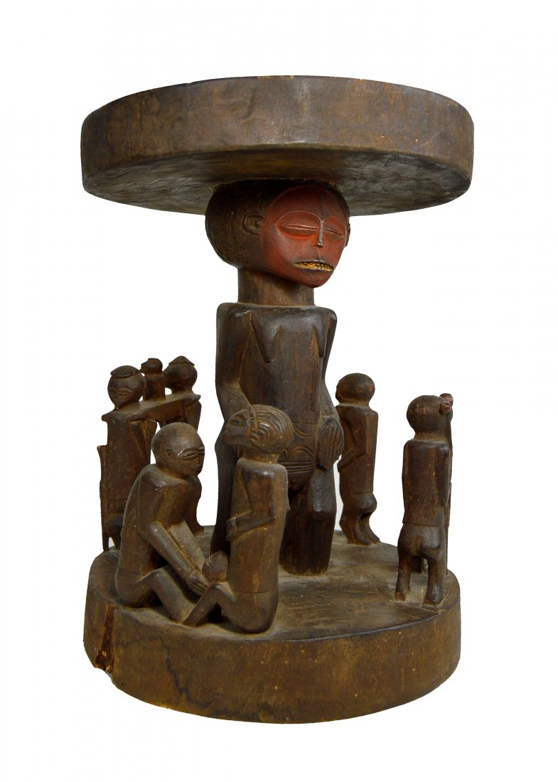 Chokwe Stool Ex Woelffer Bourgeois Authentication Paper: A very fine and elegant carved wooden stool with central female ancestor surrounded by several villages scenes, including a Child Birth, two figures carrying a small child, a female lovingly embracing