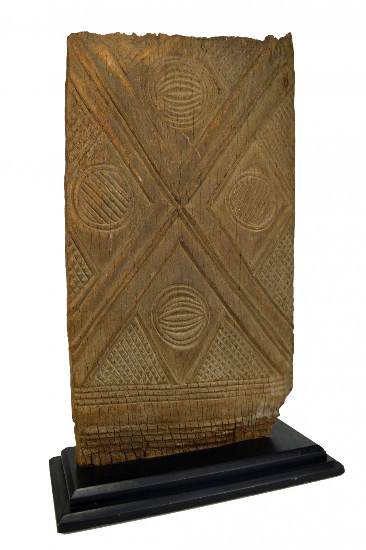 Ancient Igbo Carved Wooden African Door, Custom Mounted: A very old, heavy and intricately carved wooden door from the Igbopeople of south eastern Nigeria. Traditionally doors such as this example are carved from a sacred hardwood, known locally as \\\"Irok