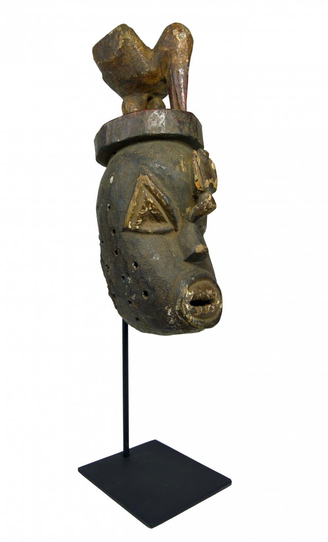 Rare Urhobo African mask with Avian Finial, African Art: A Carved wooden mask with avian finial and heavy polychromed surface, showing much handling and wear. Urhobo peoples, Nigeria, Africa. The mask itself measures 14 x 5 inches ( 21 inches tall on profes
