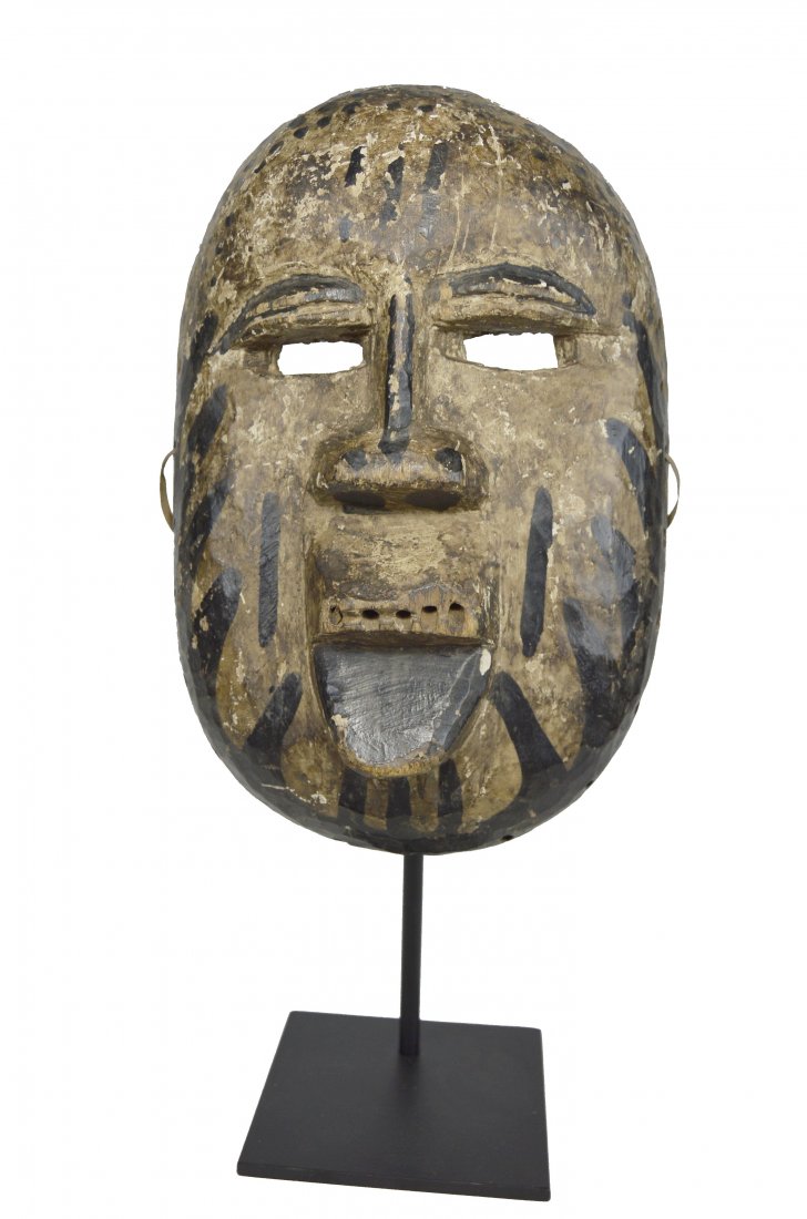 Rare Azande Mask, African Art: A carved wooden mask with painted designs and signs of handling and wear. The mask at one point had inset teeth. Azande or possibly Boa peoples, Congo, Africa. The mask measures 11.5 inches tall. A du
