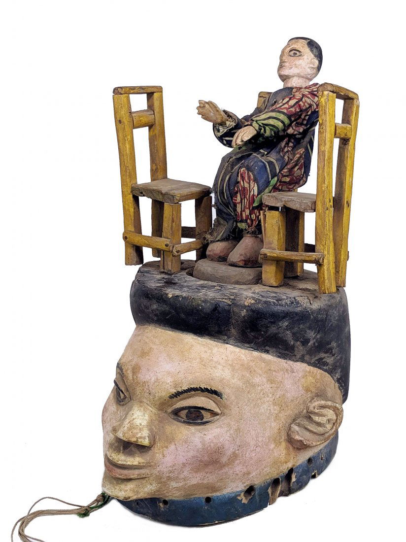 A Yoruba Gelede Mask with Musical Chairs Marionette fig (1 of 9)