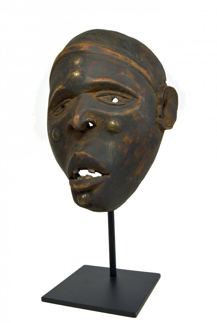 A Bakongo African mask, African Art: A very fine old Bakongo mask, carved wood with strong facial features , carved teeth and inset metal tacks. Bakongo peoples, Congo / DRC , Africa. A metal display stand can be included for an addition