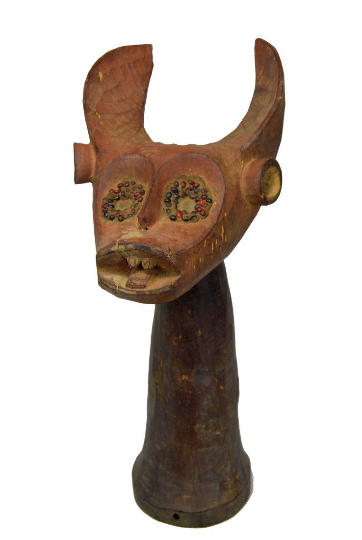 Unique Old Mama Dance Crest, African Art: A very interesting old carved wooden dance crest, with a bush cow like head atop a long neck, the eyes accented with abrus seeds. The Head has been painted with a red mineral pigment and the long neck