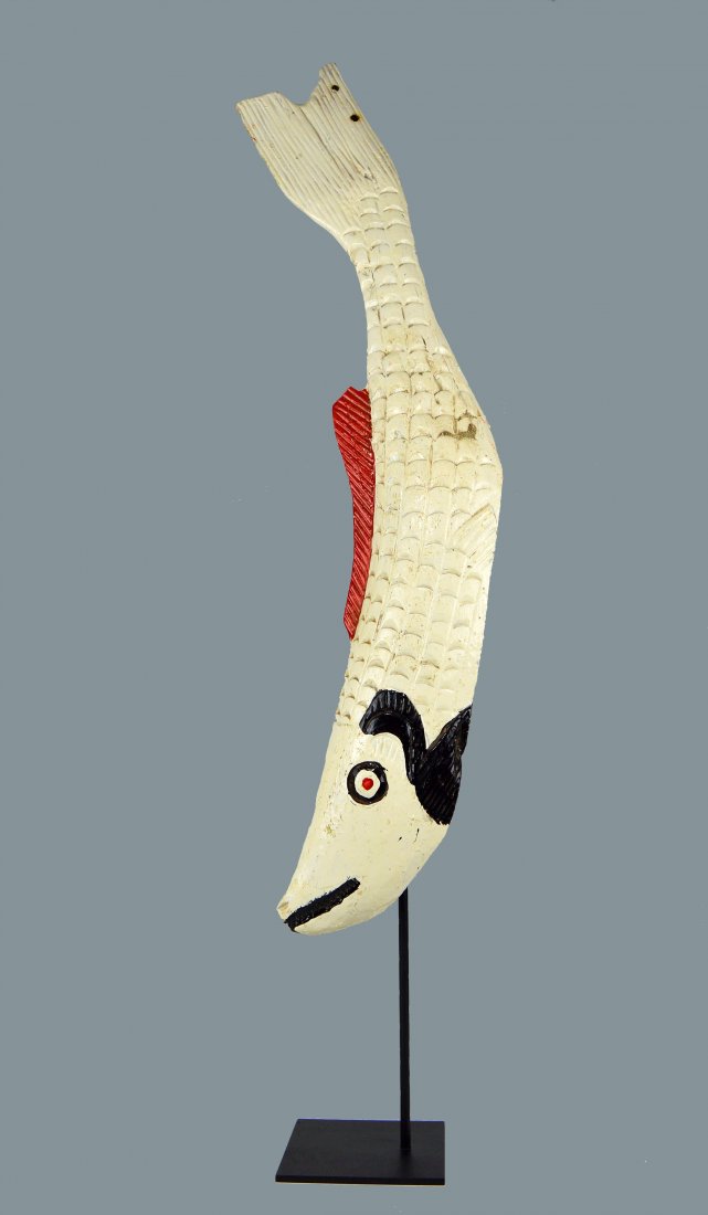 A Long Carved Wooden Fish Mask from the Bozo Peoples: A very interesting carved wooden fish mask headdress from the Bozo peoples , Mali, Africa. Such masks are worn as costumes for festival and harvest ceremonies. The mask measures 33 inches long. A meta