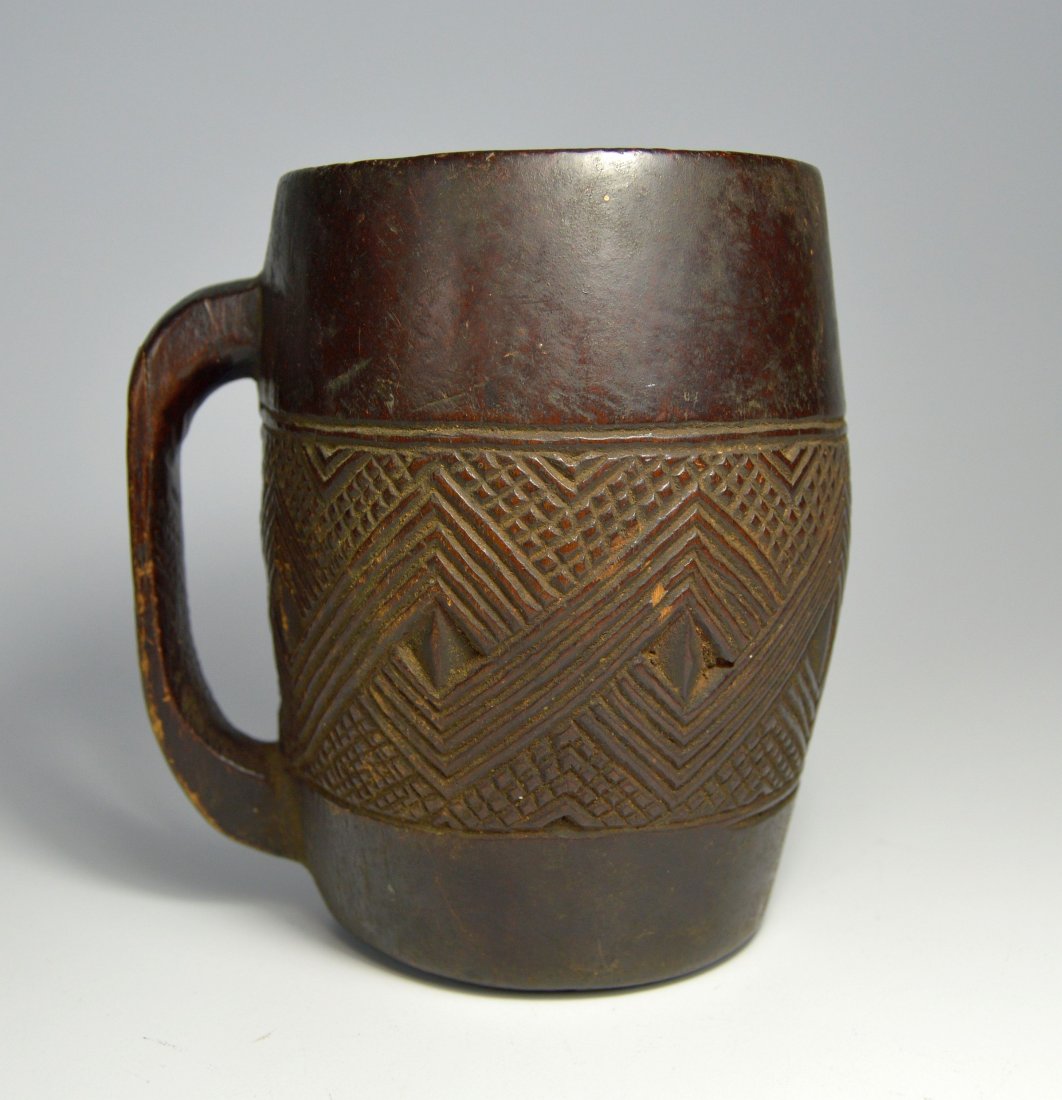Finely engraved Kuba Palm Wine Cup Ex Allan Stone Coll.: A Very Fine Old Kuba Prestige Cup from the Congo, central Africa. Kuba prestige cups were used to drink palm wine which was only served on special occasions. The dense geometric, carved patterns on th