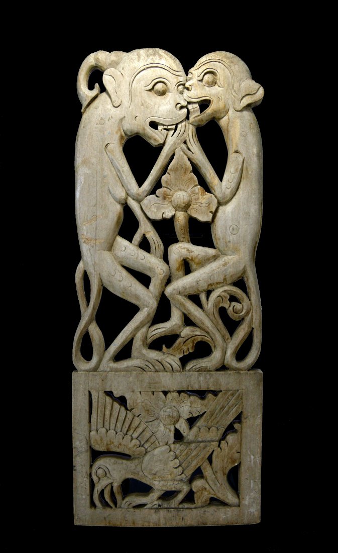 Old carved wooden Panel featuring Two Monkeys: A lovely carved panel featuring two Monkeys and an avian image on the bottom. Faded and weathered by the sun over many years , it is a charming work of art. Collected in Tegallelan village, central Ba