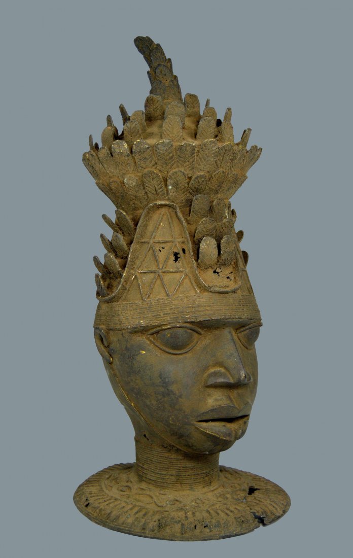 A Fine Yoruba bronze Effigy: A Finely cast bronze bust from the Yoruba, Nigeria, Africa. A ornate example depicting a member of the royal family. Measures 17 inches tall.
