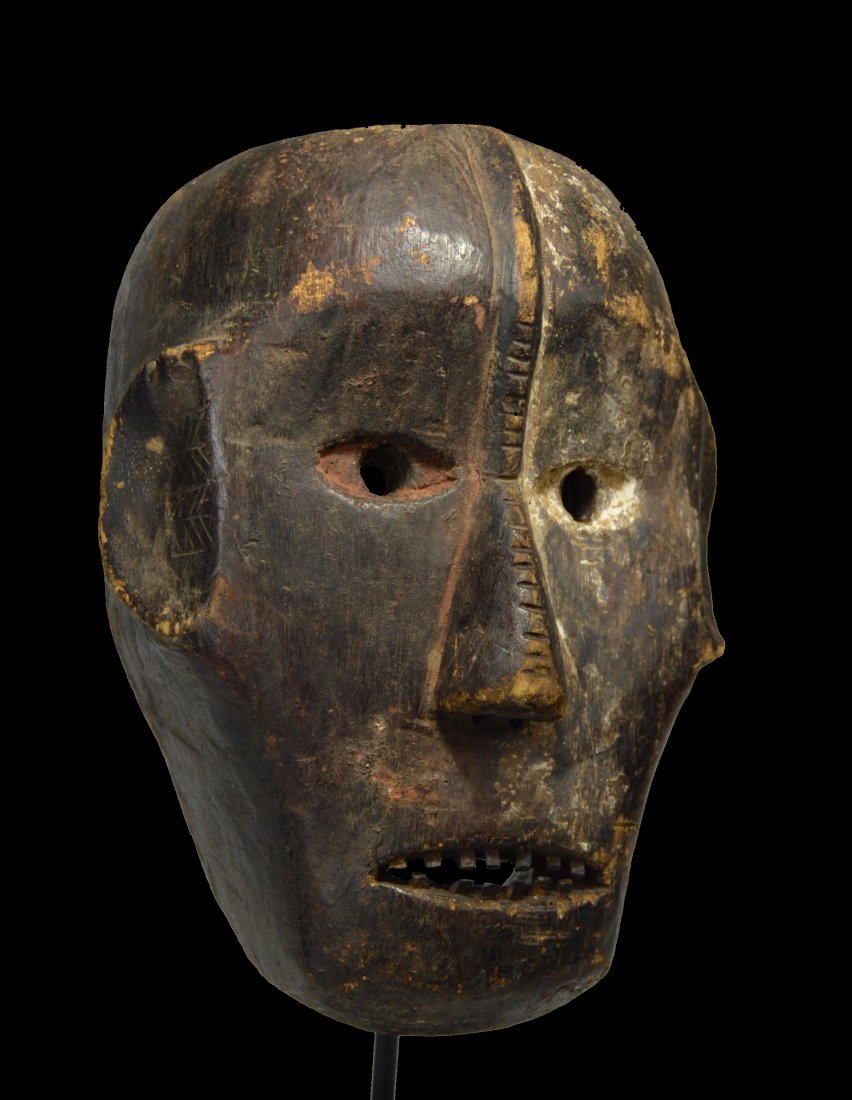 A Very rare Ngbaka African Mask Ex Gallery Amrad 1980: A rare field used Ngbaka mask with inset wooden teeth and mineral pigments. Ngbaka peoples, DRC/ Congo, central Africa. The mask measures 8.5 x 11 inches. * A metal display stand can be included for a
