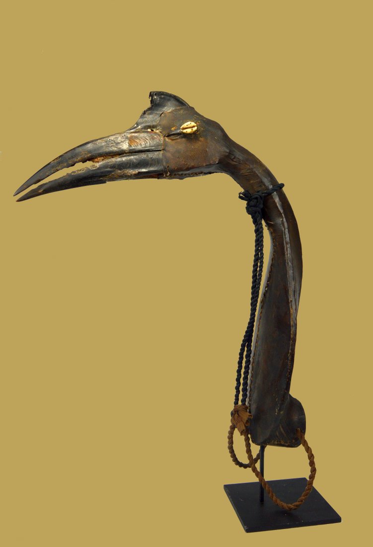 Rare Old Hausa Birds Skull Headdress, African Art: A rare Hunter’s headdress from the Hausa people of Nigeria , west Africa. Carved wood, animal beak, leather and natural fiber. The Headdress measures 18 x 15 inches ( 22 inches on professional custo