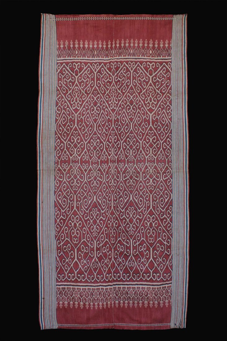 A Very Rare Old Iban Dayak Pua Ikat Ceremonial Textile: Ceremonial textile “Pua” with ikat motifs. Cotton with natural dyes. L: 94”, W: 45.5”. Early 20th century. Iban or Mualang Dayak. Sarawak State, Borneo Island, Malaysia. Provenance: Donated by