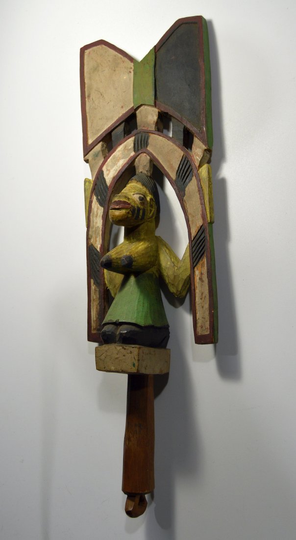 A Yoruba Shango Cult Wand, African Art: A Carved wooden staff with the Image of a kneeling female devotee, a symbol for the Cult of Shango. Shango is based upon the belief in African-derived deities who "manifest" themselves upon or possess