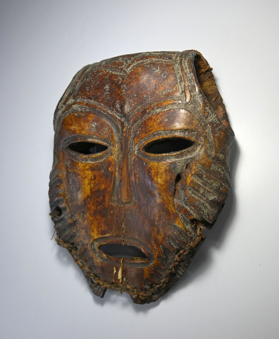 A Rare Lega Bone Mask Ex Adelman collected 1960: This is a Very rare and fine Lega Bone mask, created entirely from an animal bone and with incised facial features. lega peoples, DRC/ Congo, central Africa. The mask measures 9.25 x 7 inches. Provena