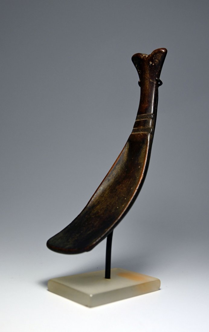 19th century Torajah Spoon Ex Jan Baum Los Angeles 1988: A very fine old carved wooden spoon or ladle with fish tail like handle and a well worn surface patina suggesting ritual use. Torajah peoples, Sulawesi ( Celebes) Island, Indonesia. The Spoon measures