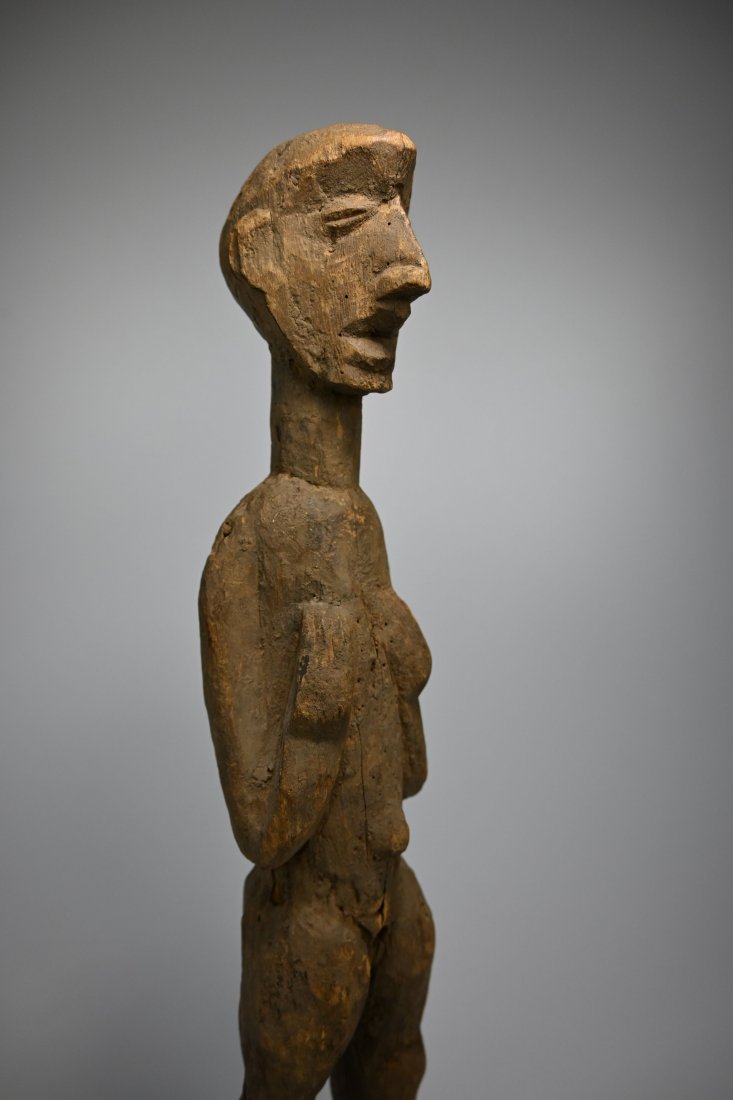 A Rare Old Tiv Shrine Idol, African Tribal Art: A carved wooden effigy with highly stylized facial features and form, and most interesting is an area where it is likely a wooden phallus was once attached. Tiv or related ethnic group, Nigeria, West