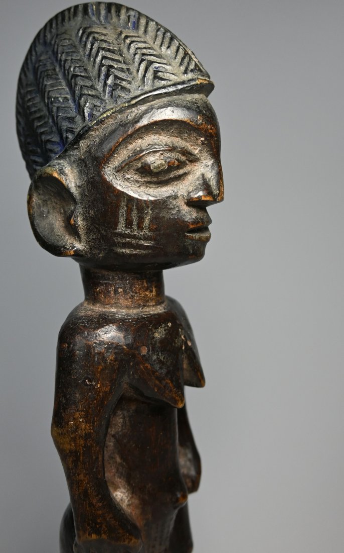 Old Yoruba Ere Ibeji Twin Idol Ex Evan Mauer Collection: A carved wooden female figure from the Yoruba peoples known as "Ere Ibeji" or Twin Idol. The mother of twins provides ritual care to such figures, bathing, dressing, adorning, and feeding them. Such d