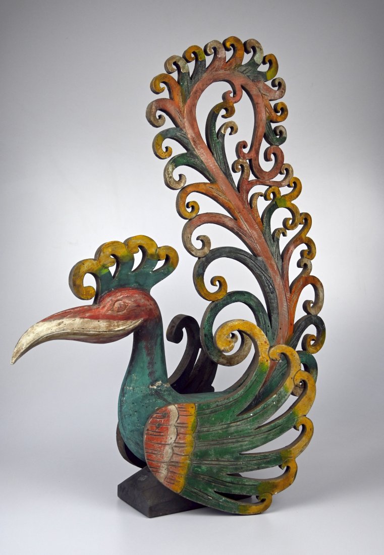 Elaborate Carved Wooden Hornbill Sculpture: A very finely crafted wooden sculpture of a Hornbill Bird with long beak and stylized tail. The sculpture measures 32 inches tall x 25 inches deep x 11 inches wide. Collected in Bali, Indonesia.